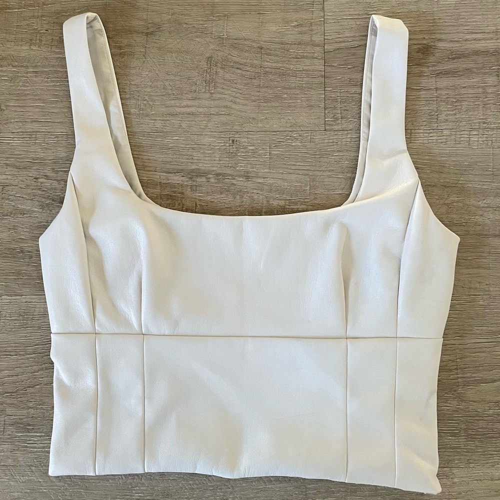 Cropped ivory bustier style top, size small. Never worn.